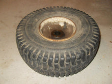 Load image into Gallery viewer, Vintage Carlisle Tire with Rim - 4.10 / 3.50 x 4